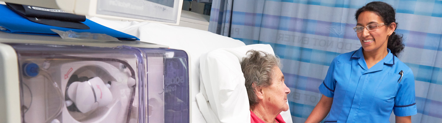 A kidney healthcare professional supports a patient on dialysis