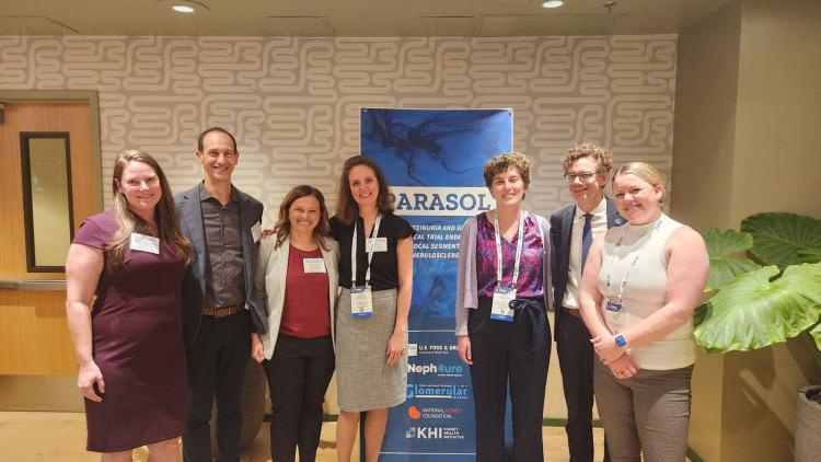 Team photo in front of PARASOL banner at ASN Kidney Week 2024