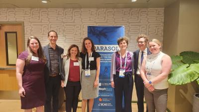 Team photo in front of PARASOL banner at ASN Kidney Week 2024